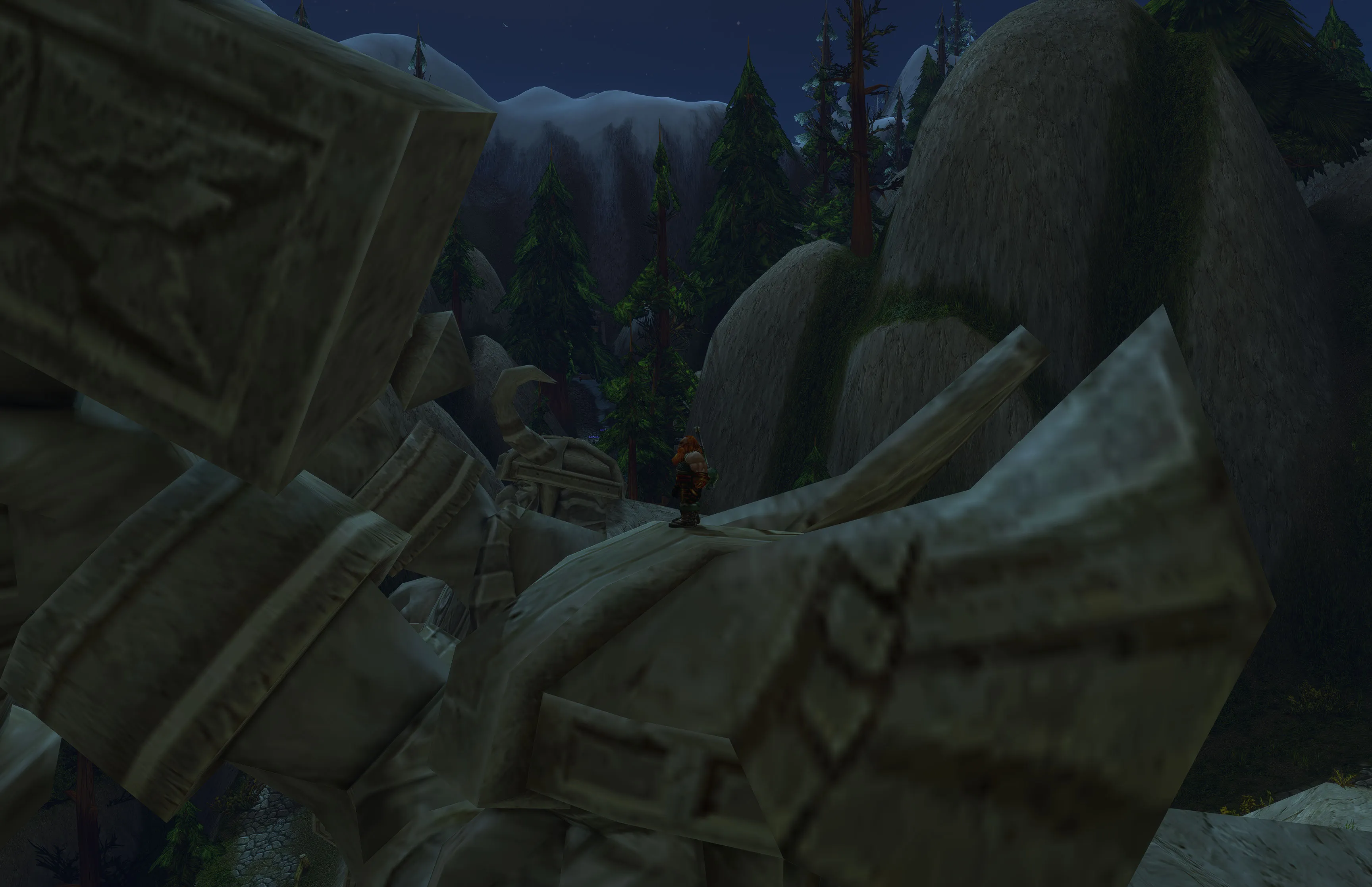 Nuir standing on the carved stone beside a giant statue’s hammer, with pines below.